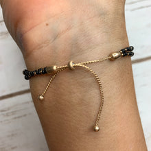 Load image into Gallery viewer, Black/Gold Coin Bracelet