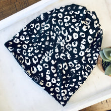 Load image into Gallery viewer, Ivory Leopard Jersey Messy Bun Beanie