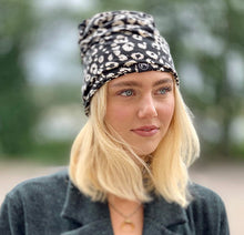 Load image into Gallery viewer, Ivory Leopard Jersey Messy Bun Beanie